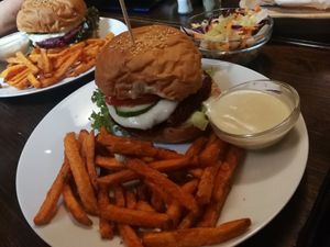 Red beet burger with sweet potato fries, and tartar sauce at Kozmosz Vegan Etterem in Budapest