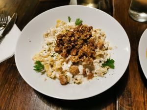 Cottage cheese pasta with seitan bacon at Kozmosz Vegan Etterem in Budapest