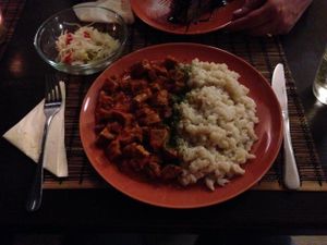 Seitan stew with dumplings and pickles at Kozmosz Vegan Etterem in Budapest