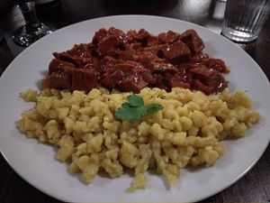 Traditional noodles and stew. Excellent! at Kozmosz Vegan Etterem in Budapest