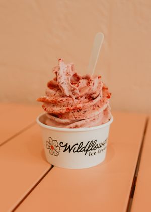 Non-dairy vanilla soft serve swirled with fresh strawberries—vegan, creamy, and made-to-order with real ingredients at Wildflower Ice Cream. at Wildflower Ice Cream in St Petersburg