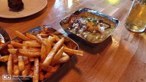 Masala fries and ragada patties at Poppadom & Pints in England