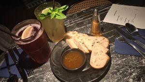 Complementary bread with a chili oil and a smoked pepper spice-mix.
Drinks where a violet-blueberry lemonade as well as a lime-mint lemonade. The lime-mint one was really good. at Vaust Bar & Restaurant in Berlin