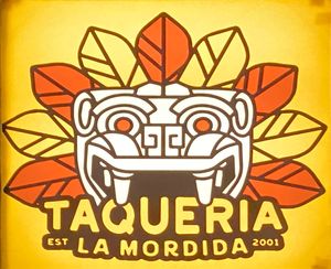 Sign out front at Taqueria la Mordida in Pacifica