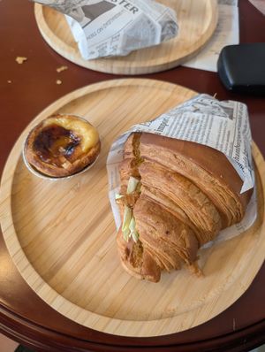 Vegan chicken and cabbage croissant, and custard tart at Moko Vegan Bakery in Lisbon