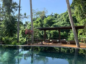 Pool with a jungle and river view at Fivelements in Mambal
