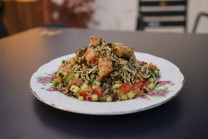 Herbed Rice with Vegambas (Meygoo Polo)
Aromatic pilaf with multiple herbs, and tangy tamarind sauce. at Noush in Barcelona