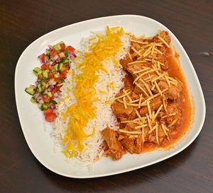 Golden Split Peas Stew (Gheymeh)
Yellow split peas and leguy fillet, in tomato sauce, served with saffron-topped rice & small fresh salad  at Noush Barcelona in Barcelona