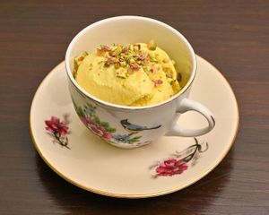 Saffron Pistachio Ice Cream (Bastani Sonnati)
Creamy saffron ice cream with chopped pistachios  at Noush Barcelona in Barcelona