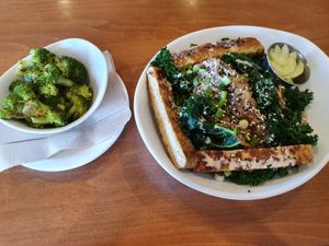 Sesame kale bowl with sauerkraut and tempeh with lemongrass broccolli on side. One of my favourite dishes at Native Foods - Point Loma in San Diego