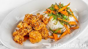 Orange Cauliflower, Oriental Style cauliflower, tossed in orange sauce, jasmin rice, snow peas and carrots. at Vegan Tierra  in North Miami
