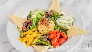 HUMMUS PLATTER/ Mixed greens, grape tomatoes, cucumbers, onions, peppers, olives, Pita bread, Greek dressing. at Vegan Tierra  in North Miami