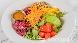 PEAR & BEETS SALAD/Arugula, wine poached pear, roasted beets, avocado, grape tomatoes, carrots, peppers, walnuts, balsamic dressing (Gluten-Free) at Vegan Tierra  in North Miami