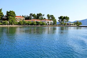 Natural coastline and swimming spots just steps from the hotel at Hotel Korinjak in Veli Iz