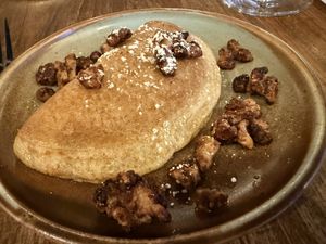 Qatayef (V)
Baked "crepe" stuffed with walnuts and cinnamon drizzled with house syrup and caramelized walnuts  at Levant in Petaluma