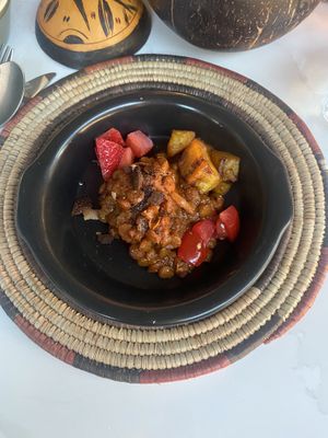 Lentils with deep fried plantains and fruit  at Yaya's Kitchen in London