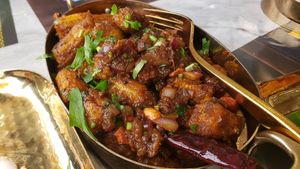 Babycorn karivepaku ($15). Spicy, savory babycorn dish. Wish it had been crispier, but it's still good. at Simply South - Indian Vegetarian Restaurant in Warrenville