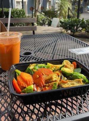 Thai Iced Tea and meal on the patio at Araya's Place - Madison St in Seattle