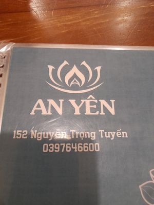 Menu cover with name and phone number at Chay An Yên in Ho Chi Minh City