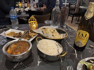 Imli Eggplant app (rectangular plate), and Tofu Jalfrezi (silver bowl).  Garlic naan also shown (not veg).  at Magic Masala Indian Cuisine in Naples