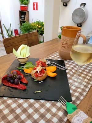 Seasonal vegetables & fruits. Bruscetta with tomatoes, basil, eggplant confit and lemon zest at C'era Una Volta Shop in Brindisi