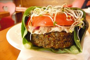 Almond Cheeze Burger, ready wrapped in a fresh collard leaf and topped with cashew cheeze and mustard. at B.Love Concious Eatery in Dundas