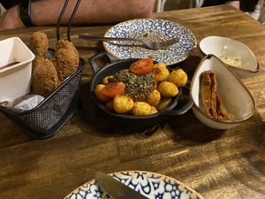 Nugget style fingers, crispy gnocchi and marinated tomatoes and tofu at Bubita Bar in Barcelona