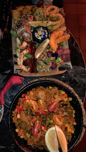 Sea food plate and chicken paella at Bubita Bar in Barcelona