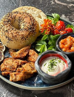 Brunch with chicken challenge bagel at Bubita Bar in Barcelona