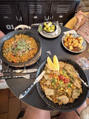 Vegalenciana and Mushrooms Paellas, plus backend Gnocchi and Olives.   at Bubita Bar in Barcelona