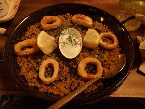 Del chef paella, served with 'Calamari' rings at Bubita Bar in Barcelona