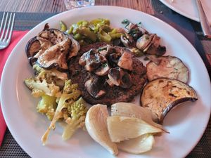 Mushroom burger + cooked veggies at Veganda in Padua