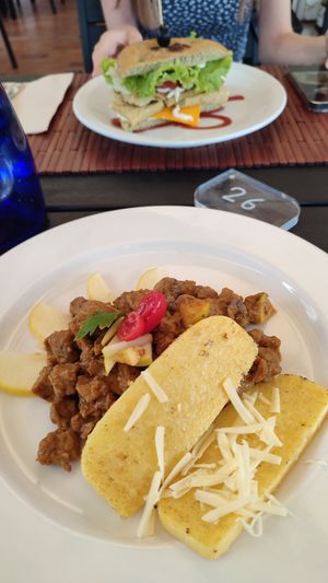 Spezzatino di soia, con polenta, mela e formaggio veg at Veganda in Padua