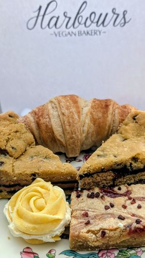 Our take-home treats, croissant, biscoff cookie pie, twyx cookie pie, raspberry ripple blondie, veganese whirl at Harbours Vegan Bakery in Lancing