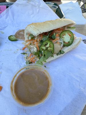 Half of a Tofu bahn mi with side of peanut sauce  at V-Roll Vietnamese Rolls & Bowls in Gulfport