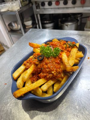 Their “Vegan Bolognese Fries”! Literally spaghetti sauce over French fries but they’re sooooooooo good! Made with their brand’s special plant-based protein| at Miss Green - Dunhua in Taipei