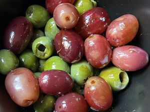 Marinated Castelvetrano olives & red grapes  at Charlie Was a Sinner in Philadelphia