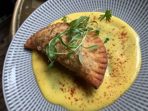 Curried sweet pea & potato empanada at Charlie Was a Sinner in Philadelphia