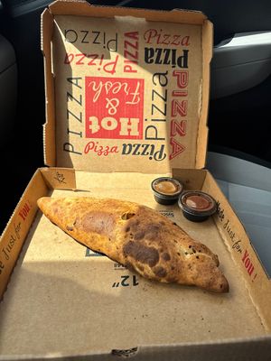 Vegan calzone with marinara and their sweet chili sauces!  at Lazy Moon Pizza in Orlando