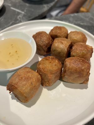 A rare vegan treat! Crispy on the outside, filled with minced tofu skin and crunchy water chestnuts. Perfect with sweet plum sauce – a true taste of Chinese comfort.  at So Vegan - Phoenix Pratunam in Bangkok