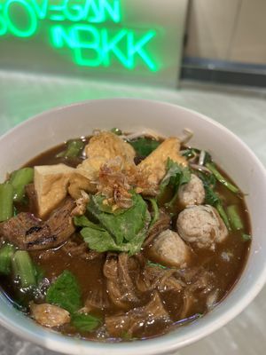 Fragrant soup with braised shiitake stems, paired with soft noodles – simple, hearty, and deeply satisfying.  at So Vegan - Phoenix Pratunam in Bangkok