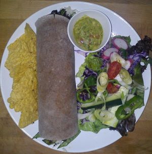 Chunky Wrap with guacamole, chips & side salad at Chirimoya Healthy Food Station in Fuengirola