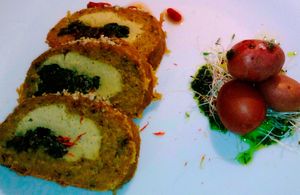 Seitan filled with tofu and spinach. To the right Canarian potatoes with green mojo. at Private Chef - Emotional Vegan Food in Lanzarote