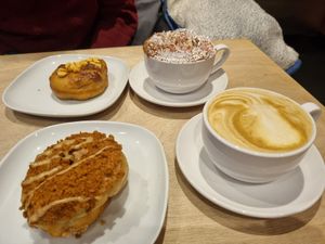 Honeycomb doughnut with a hot chocolate. Biscoff doughnut with a soy latte. at Considerit in Edinburgh