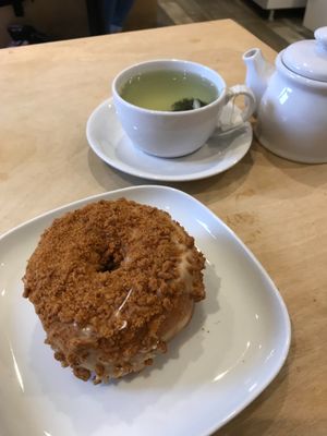 Lotus biscoff doughnut and a matcha green tea at Considerit in Edinburgh