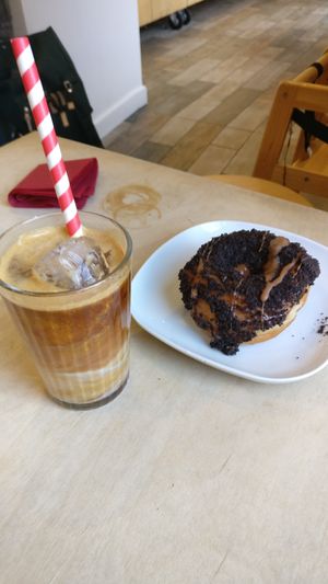 Oreo doughnut and iced almond milk latte at Considerit in Edinburgh