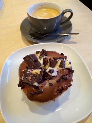Creme egg doughnut made with broken pieces of creme egg bar at Considerit in Edinburgh