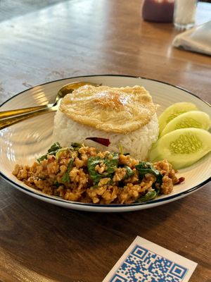 Pad Krapao (stir fried holy basil with ground “pork” and a fried “egg”)  at Mello in Bangkok