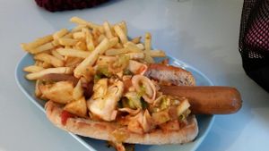 Smoky sausage role with the hot relish. And French Fries.  at Astrid och Aporna - Astrid og Aberne in Copenhagen