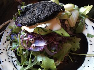 Vegetable pancake with salad and zucchini carpaccio  at Soda in Alba